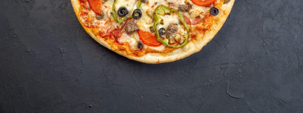top-view-delicious-cheese-pizza-with-olives-pepper-tomatoes-dark-surface